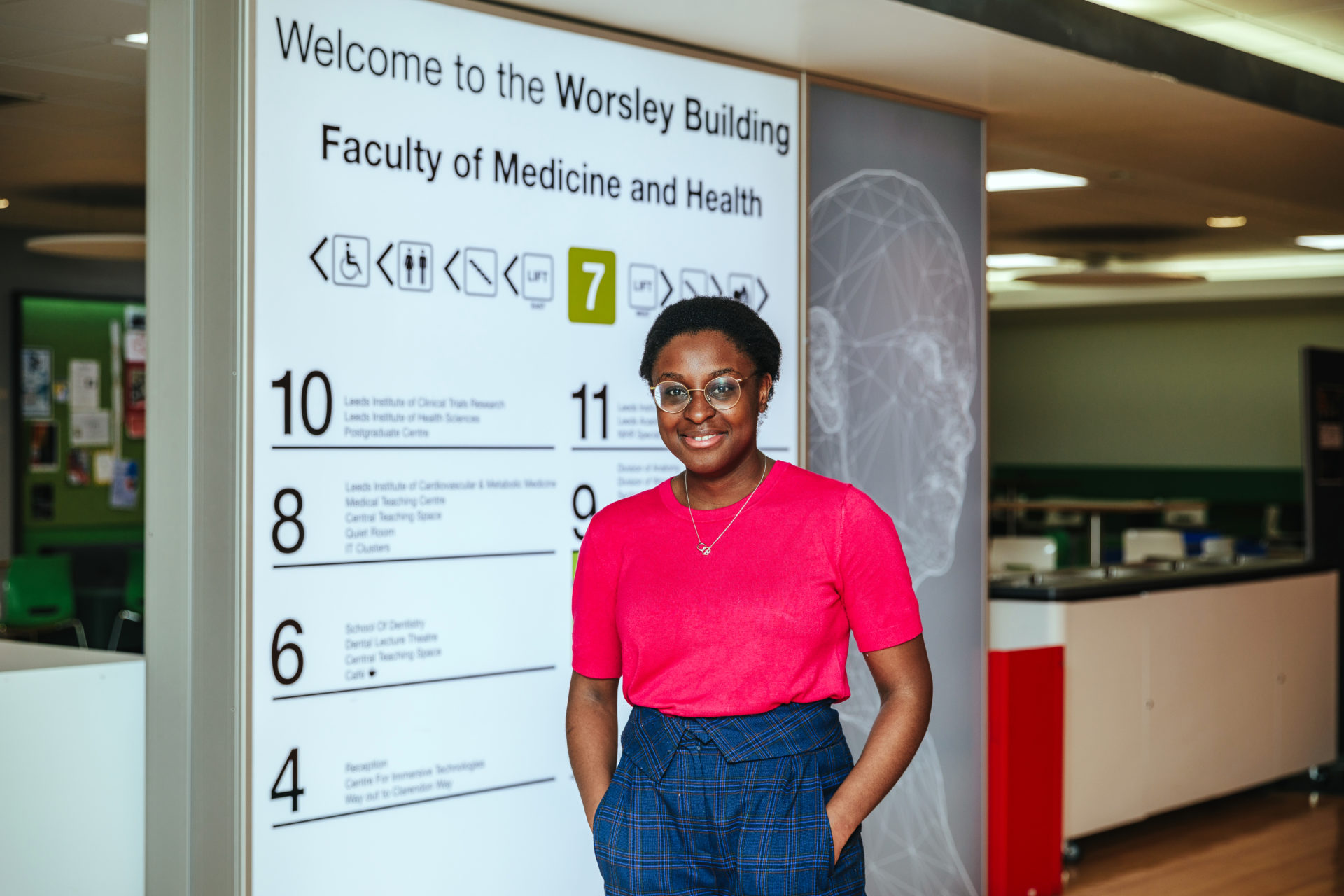 Sophie-Rose stands in the Faculty of Medicine, smiling. 